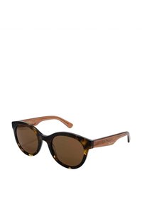 Gafas de sol de estilo gato con montura de carey oscuro y lentes marrones. Las patillas presentan un color marrón claro en contraste con acentos geométricos.