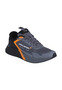 Gray athletic shoe with mesh upper, orange accents, and rubber sole. Features logo on the side and reinforced toe for durability.