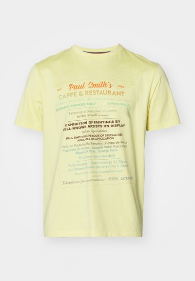 Yellow cotton t-shirt featuring printed text in various colors, with restaurant details and specialties, round neck design, short sleeves.