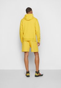 Nike Sportswear REVIVAL HOODIE - Sweatshirt com capuz - vivid sulfur
