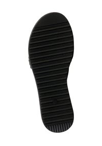 Suola di scarpa in gomma nera con scanalature orizzontali e verticali, punta arrotondata, tacco leggermente rialzato e un motivo di presa testurizzato.