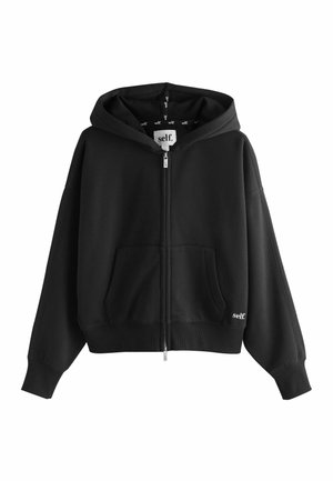 Schwarzer Kapuzenpullover mit Reißverschluss, Fronttaschen, gerippten Bündchen und kleinem "self."-Logo auf der Brust und innen in der Kapuze.