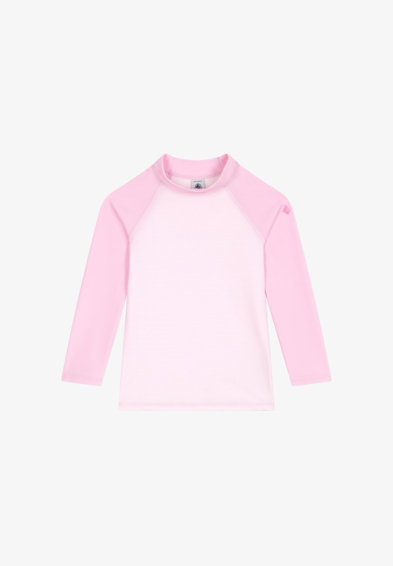 Rash guard à manches longues en rose clair, avec une texture côtelée sur le corps et des manches raglan roses unies. Col rond.