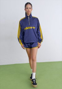 adidas Originals FLARED - Leggings - Calças - dark blue