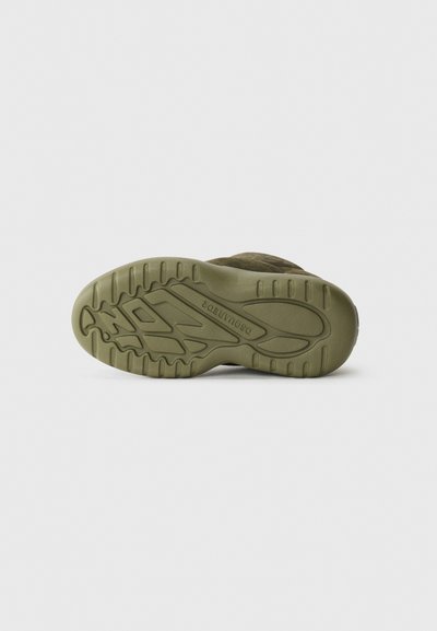 Olive green shoe sole with textured diagonal tread patterns and raised grip areas. Made of rubber, featuring a rounded toe and curved edges.