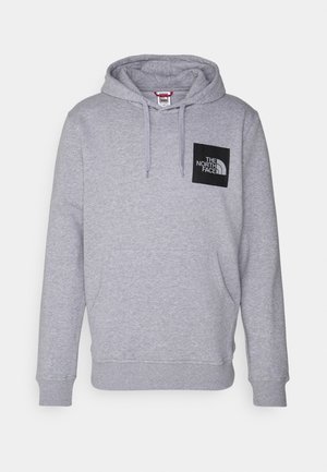 Gray pullover hoodie made of cotton blend, featuring a front kangaroo pocket and a black square logo patch on the left chest.