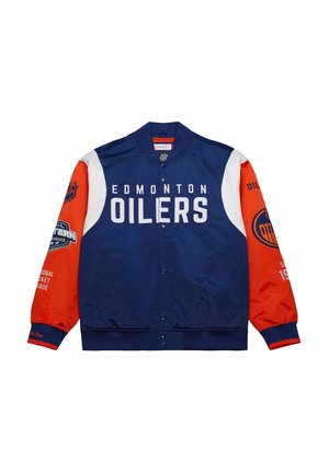 Giacca bomber degli Edmonton Oilers con corpo blu, maniche arancioni, accenti bianchi e logo prominente. Presenta bottoni a pressione e branding NHL.