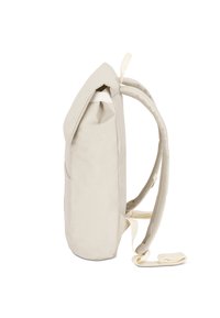 Light beige backpack with a rounded shape, smooth material, and mesh straps. Features a folded top and adjustable, padded shoulder straps.