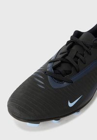 Black soccer cleat with textured upper, blue accents, and black laces. Features a contoured shape and molded studs for traction.
