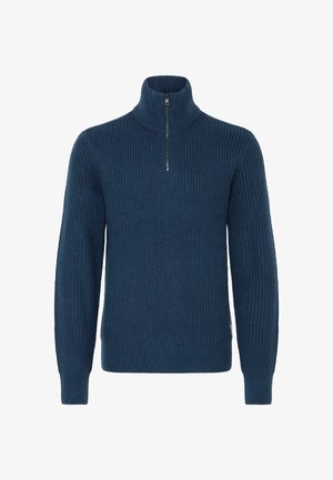 Dyp blå strikkegenser med høyt krage og halv-glidelås. Har ripet tekstur og tettsittende mansjetter for en god passform.