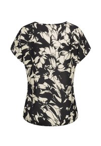 Kurzes Blusenshirt in Creme mit einem schwarzen Blumenmuster. Hat einen runden Halsausschnitt und eine lockere Passform mit einem abgerundeten Saum.