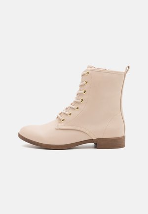 Bottines à lacets - beige