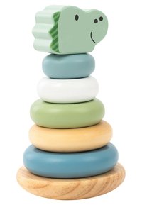 Wooden stacking toy with five round rings in blue, green, white, and beige, topped by a green dinosaur head with a smile and stripes.