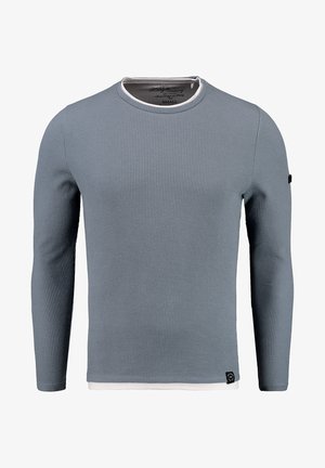 Lange mouwen shirt in lichtblauw geribbeld materiaal met een witte ronde hals. Voorzien van een merklabel aan de linker onderzoom.