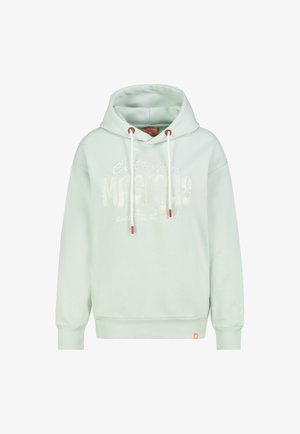 Light green hooded sweatshirt with white drawstrings and French text "C'est toujours Magique avec toi et moi" printed in white on front.