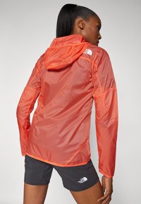 The North Face SHELL - Windbreakers - radiant orange/black