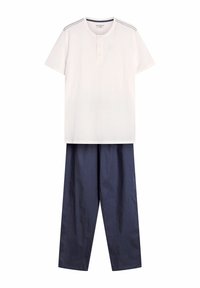 White short-sleeve t-shirt with a henley neckline and three buttons, paired with navy blue wide-leg pants made of lightweight material.