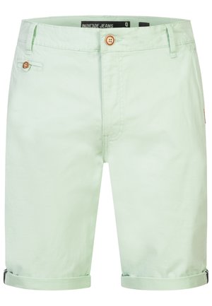 Muntgroene katoenen shorts met opgerolde zomen, voorzien van twee voorzakken, één knoopsluiting en een merketiket op de tailleband.