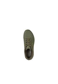 Green athletic shoe with perforated design, textured lace-up front, and cushioned sole. Features logo on the side and inside the shoe.