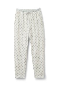 Lichtbeige bloemenpyjamabroek met een elastische tailleband, koord en zijzakken, met een verspreid patroon van blauwe bloemen.