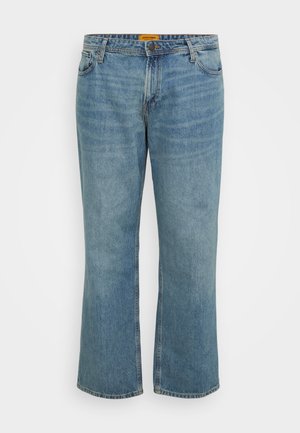 Light blue denim jeans with a straight leg cut, five pockets, visible stitching, and a zip fly. Label is yellow on the inside waistband.