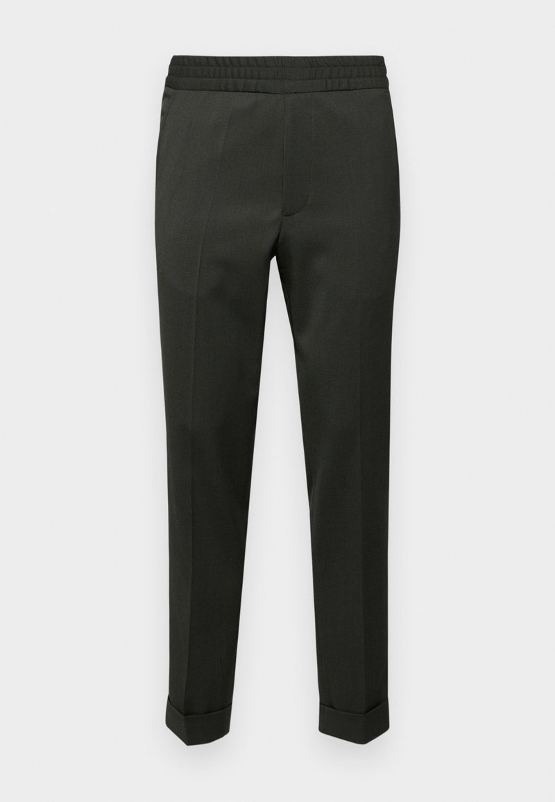 Pantalon noir fuselé avec taille élastique et ourlets retroussés, présenté sur un fond clair uni.