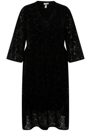 Vestido de terciopelo negro con escote en V, mangas largas y un estampado floral. El dobladillo es ligeramente acampanado y presenta un acabado texturizado.