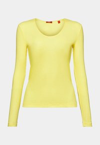 Langärmliges, gelbes Ripp-Shirt mit rundem Ausschnitt, aus weichem Stoff gefertigt, mit einfacher Naht und enger Passform.