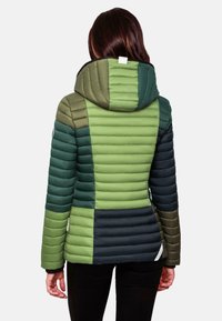 Padded jacket with a drawstring hood, featuring green and navy color blocks, vertical quilted texture, and zipper details on the sides.