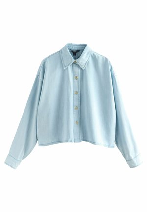 Light blue cropped denim shirt with long sleeves, collar, and five beige buttons down the front.