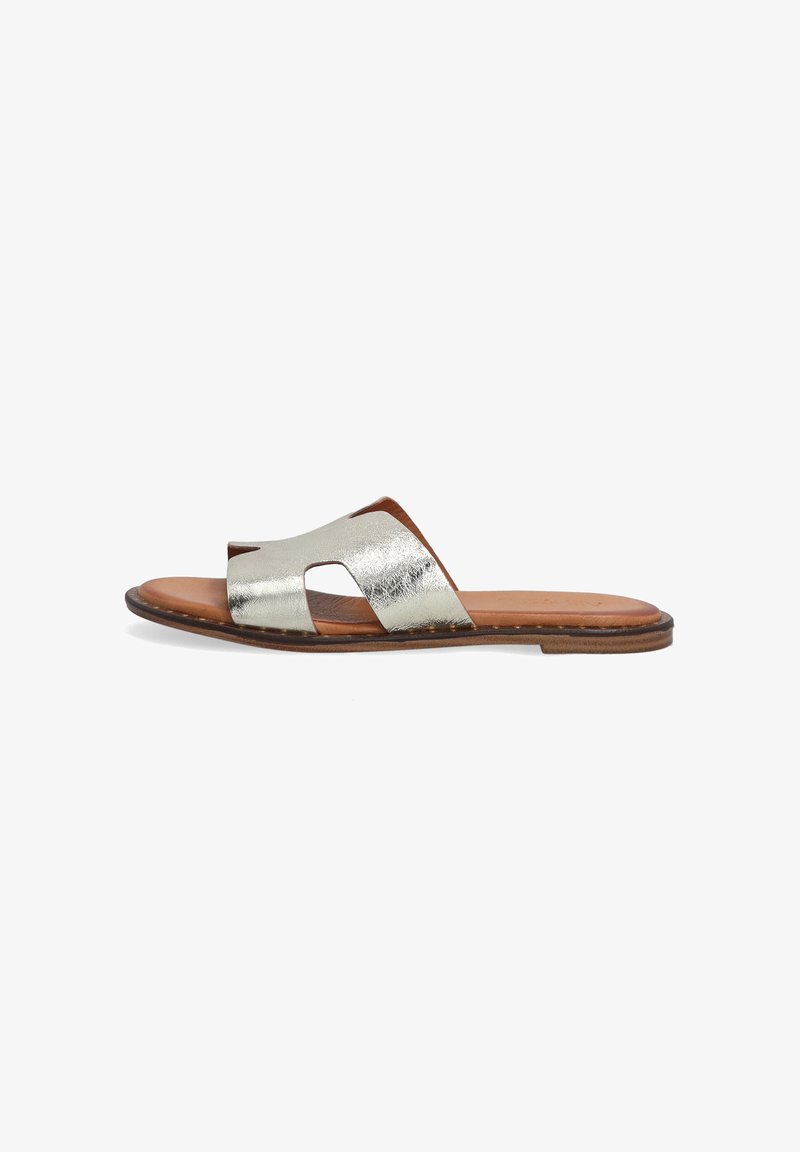 Metallic silver slide sandal with an open toe design, featuring a layered strap and a tan leather insole. Flat sole with minimal stitching detail.