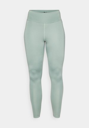 Leggings vert clair avec une texture lisse et extensible, dotées d'une taille haute et sans coutures visibles. Design à longueur complète.