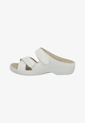 White open-toe slip-on sandal with two adjustable straps and textured sole, designed for comfort and easy wear.