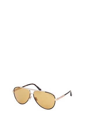 Zonnebril in aviator-stijl met goudkleurige glazen, een dunnen gouden metalen montuur en pootjes met schildpadmotief.