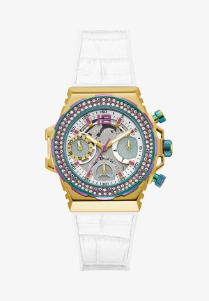 Montre dorée avec un bracelet en silicone blanc, cadran multicolore orné de strass, et trois sous-cadrans sur un fond argenté.