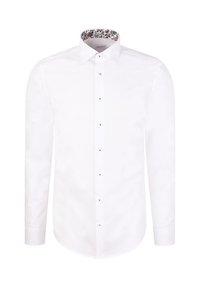 Chemise blanche à manches longues avec un col intérieur à motif floral, une fermeture boutonnée avec des accents argentés et un ourlet arrondi.