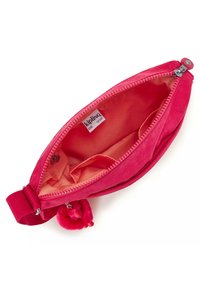 Borsa in tessuto rosa con zip, con un morbido interno e un accento in pompon sul tirazip. Etichette "Kipling" all'interno.