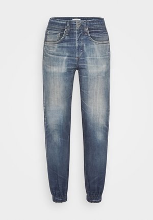 Denim-juoksuhousut keski- tai tummansinisellä pesulla, jossa haalistunut efekti, varustettu joustavilla lahkeensuilla ja perinteisellä viiden taskun mallilla.