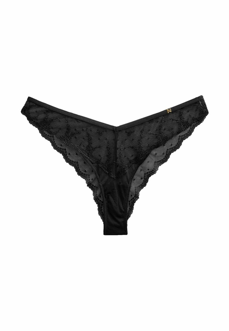 Black lace thong featuring floral patterns, scalloped edges, and a smooth waistband. Decorative gold accent on the front.