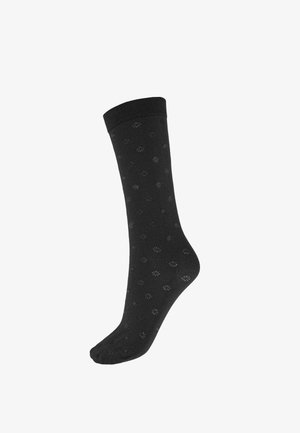 Calzino alla caviglia nero in tessuto morbido con un sottile motivo floreale su tutta la superficie e un risvolto a coste per una calzata sicura.