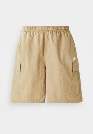 Bermudas de sarja bege com um cós elástico, bolsos frontais e um pequeno logótipo branco da Nike. Tecido leve com uma textura enrugada.