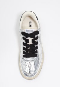 Silver, textured sneaker with black laces and a white interior. Features "BIMBA" logo on the tongue. Rubber sole with a light color.