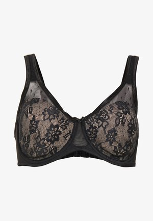 Soutien-gorge en dentelle noire avec des motifs floraux, des panneaux transparents et des bretelles réglables. Équipé d'une fermeture à crochets et d'un bandeau noir lisse.