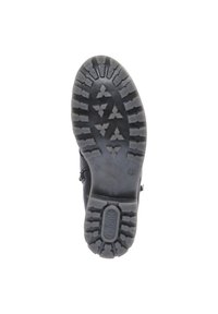 Schwarze Gummistiefelsohle mit tiefem Profilmuster. Verfügt über dreieckige und rechteckige Formen für bessere Traktion. Zentrales Logo ist in die Sohle eingeprägt.