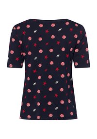 Navy cotton t-shirt featuring a repeating pattern of red stars, seashells, and lips. Round neckline and short sleeves. Casual fit.