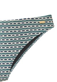 Krupni plan zelenih i bijelih gaćica bikinija s mornarskoplavim ovalnim uzorcima i malom zlatnom oznakom marke na pojasu.