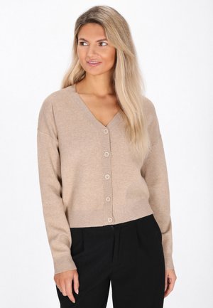 Beige wollen cardigan met een V-hals, lange mouwen en zes knopen aan de voorkant. Ribgebreide manchetten en zoom met een iets verkorte snit.