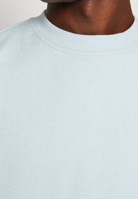 Weekday Mikina - light blue