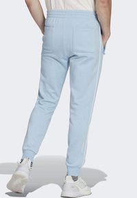 adidas Originals ADICOLOR SEASONAL ARCHIVE - Tracksuit bottoms - clear sky