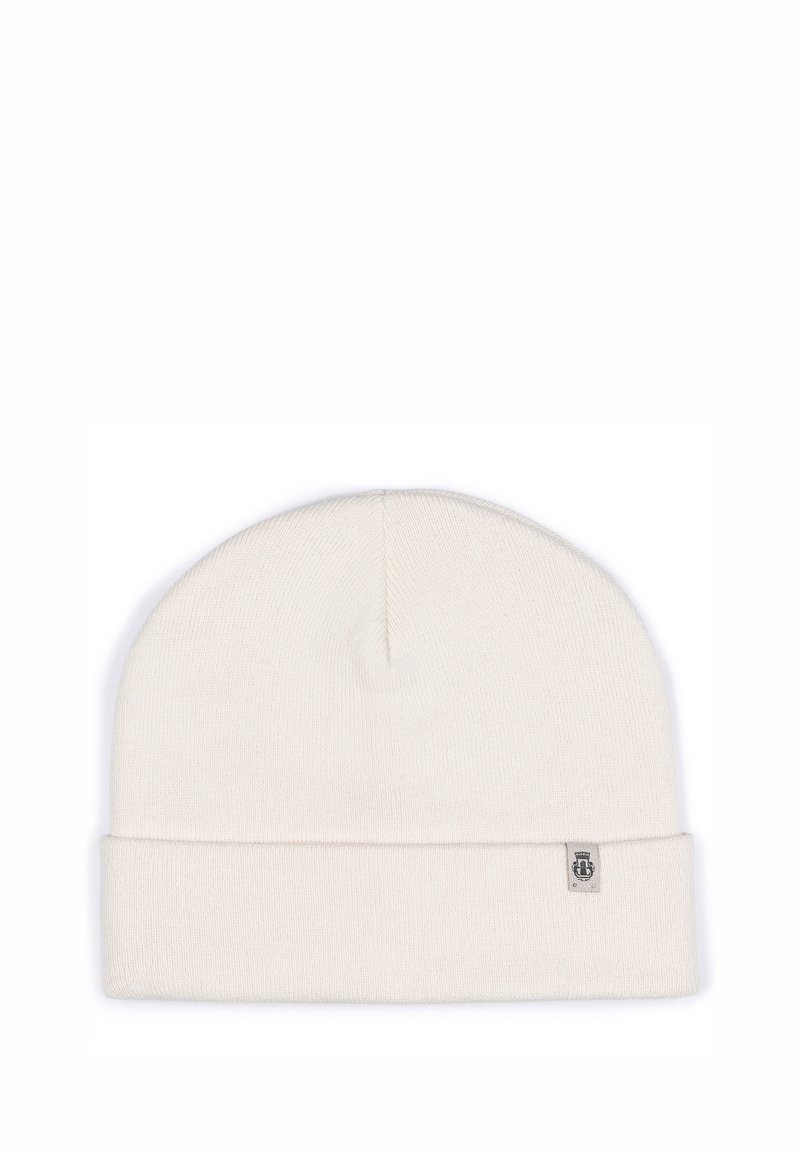 Cream-colored knit beanie with a folded cuff, made of soft material, featuring a small branded label on the side. Simple and seamless design.